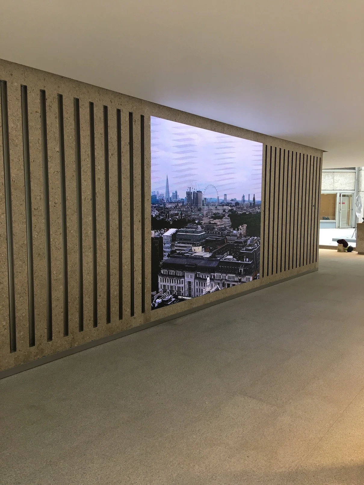 Large integrated indoor LED video wall set into an architectural feature wall